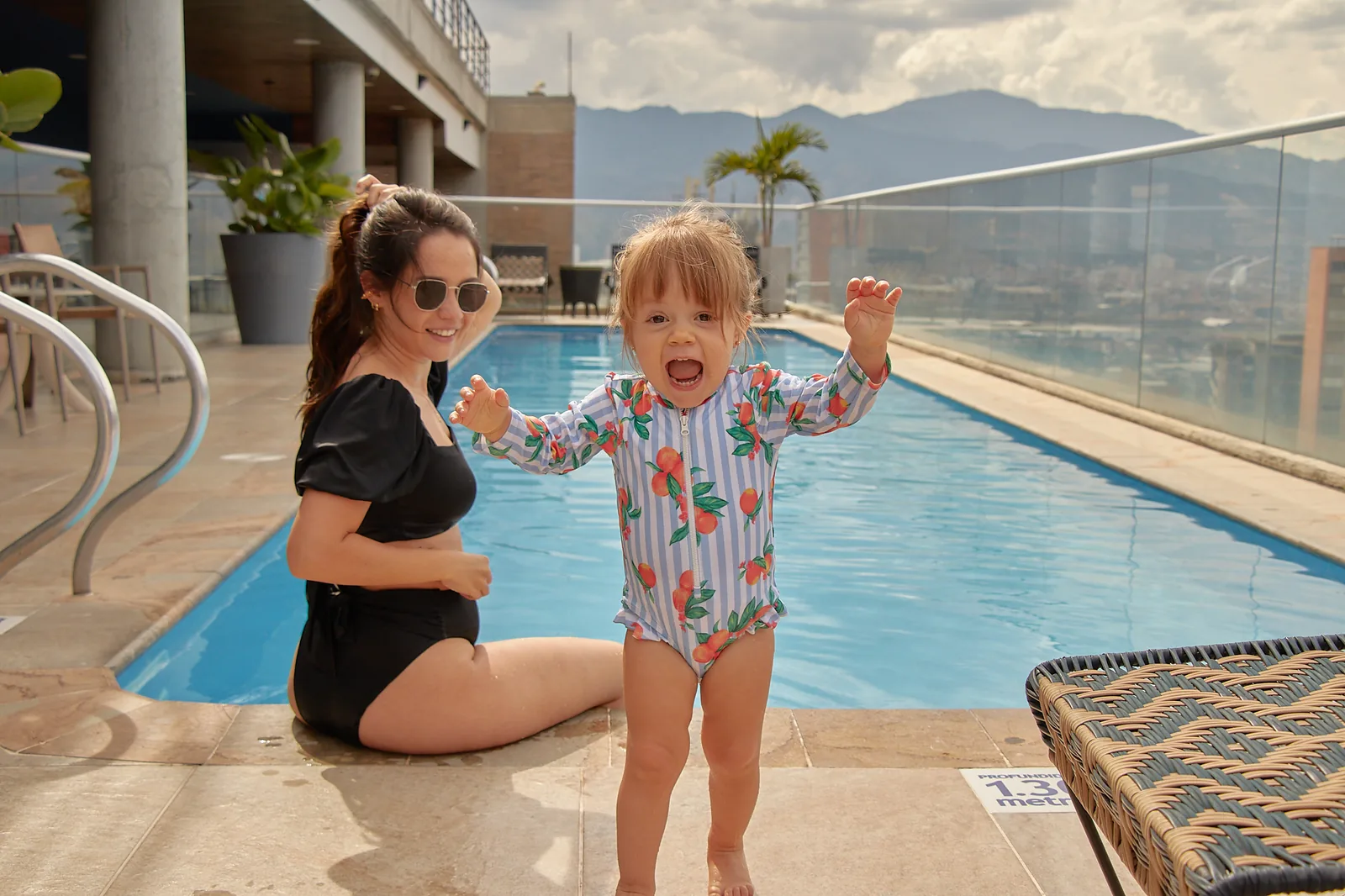 Toddler playing in the rooftop pool at Soul Lifestyle Apartments, El Poblado